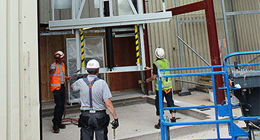 Workers installing lift