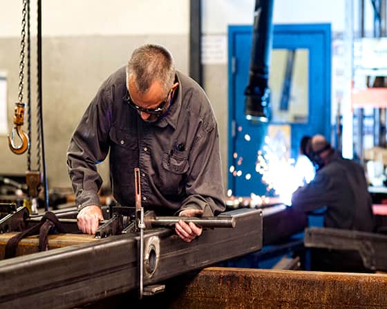 man welding table at translyft