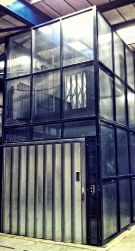 black mastlift in warehouse
