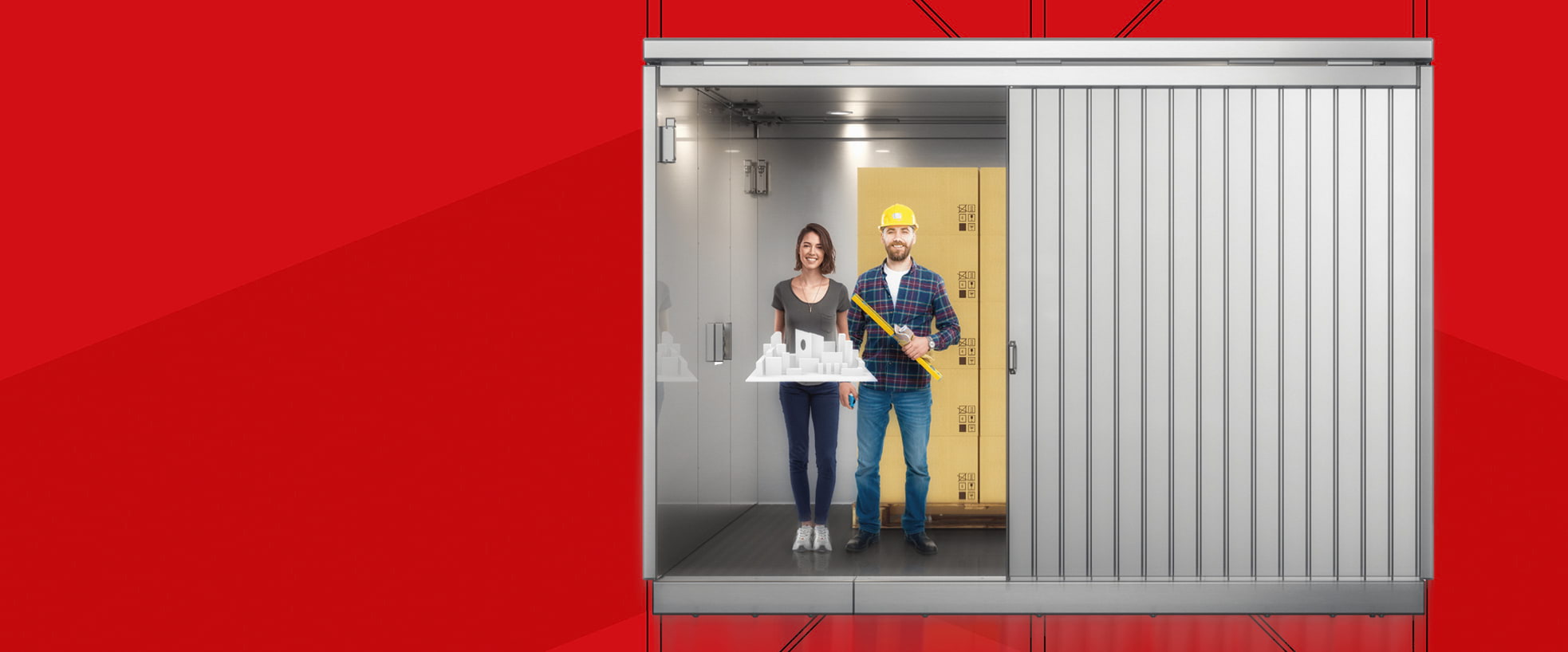Man and woman in Hidral goods lift 