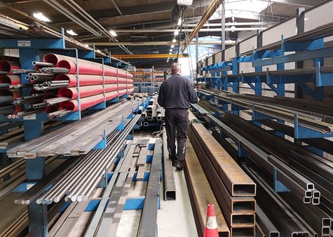 Worker between steel pipes